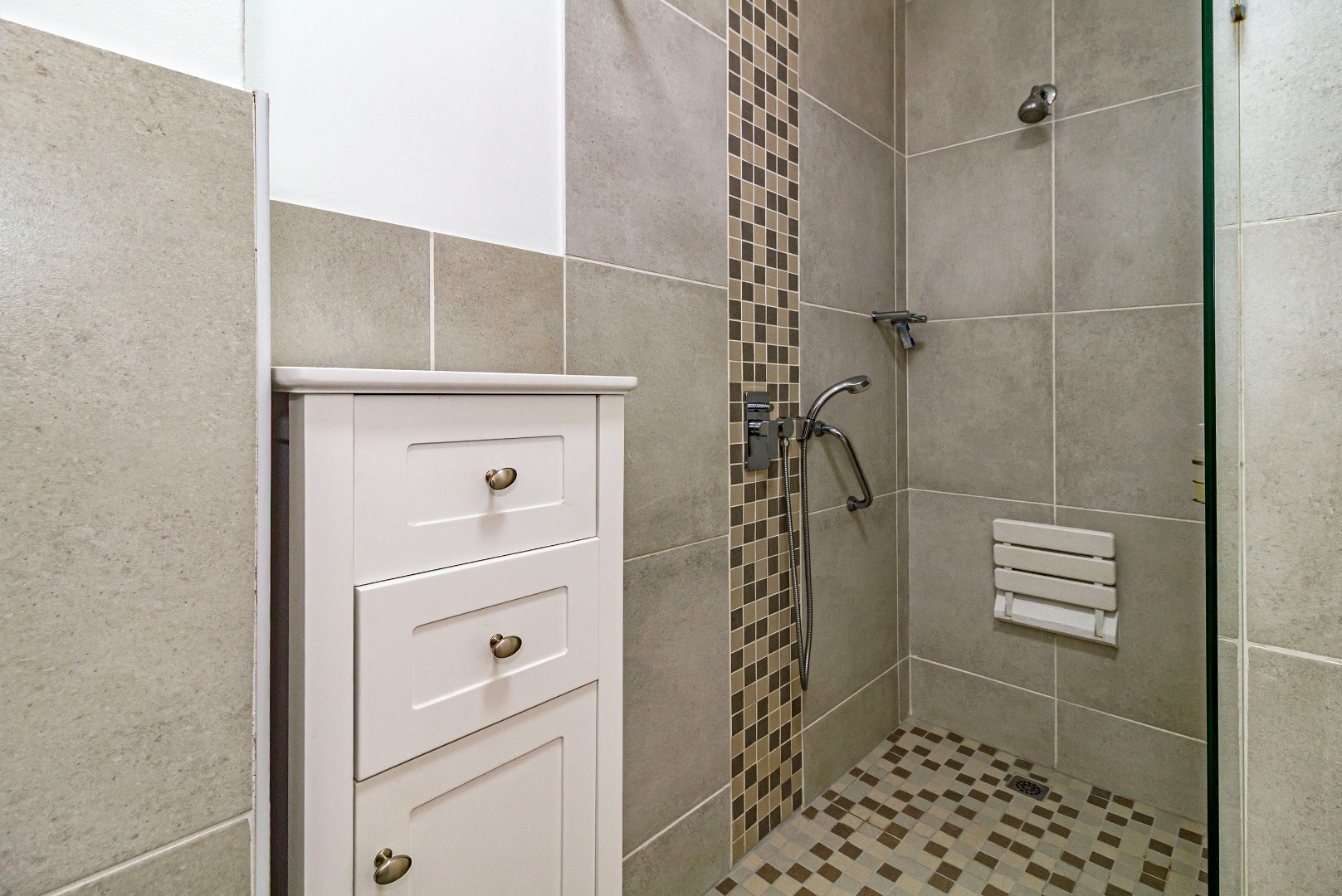 Large walk in shower with seat and support rails