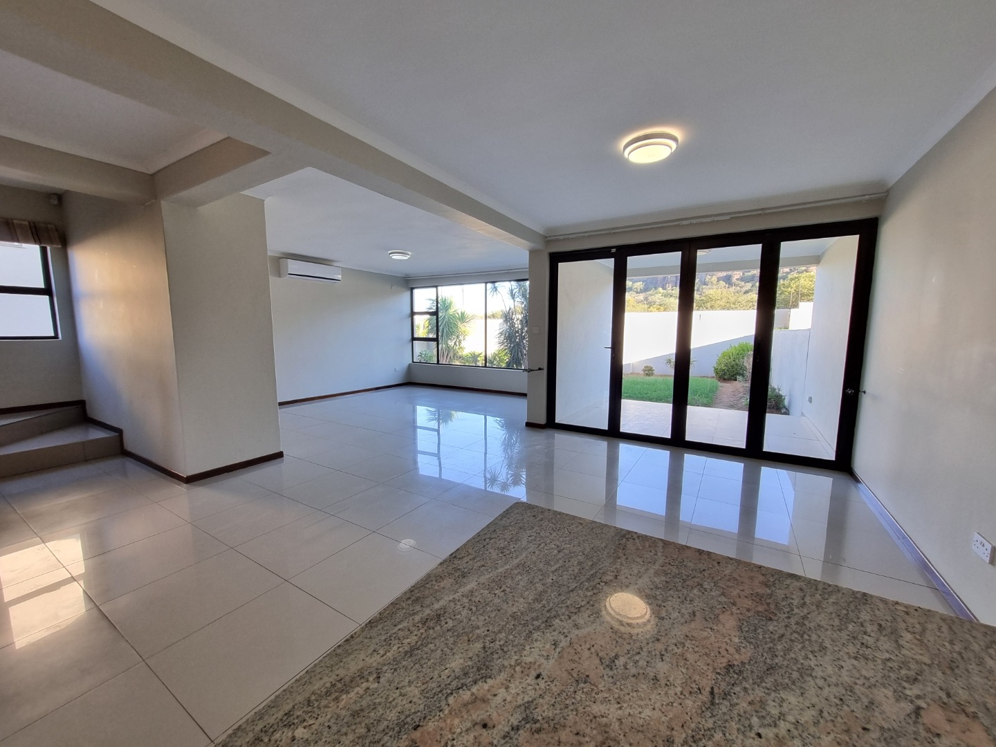 Open plan lounge/dining area with patio