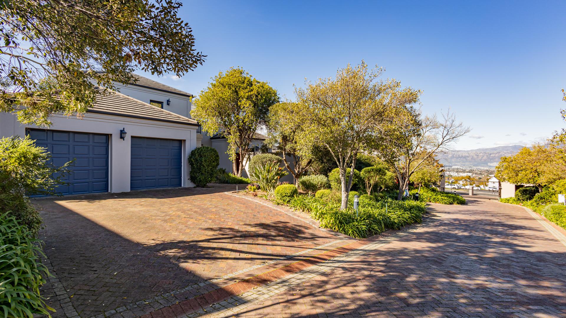 Entrance of home with view of entrance gate