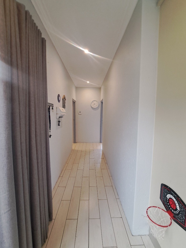 The passage to the 2nd and 3rd bedrooms